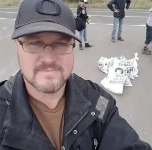 Man at beach cleanup in Oregon