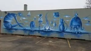 light blue dreamy cat fantasy mural in portland