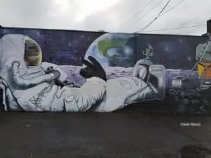 monkey in spacesuit mural by pablo in portland