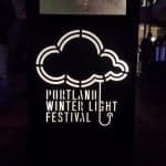 portland winter light festival logo rain cloud and umbrella handle