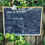 chalkboard of the neighborhood movie schedule